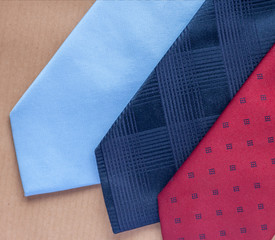 three ties on craft background
