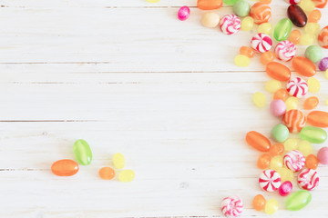 Naklejka na ściany i meble variety of candies on a wooden background