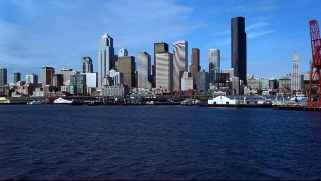 Low flight toward Seattle waterfront and skyline. Shot in 2000.