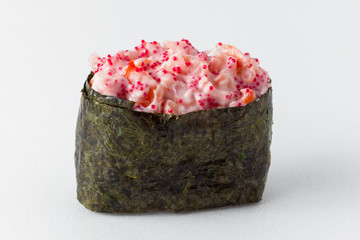 Spice sushi with fish and red tobiko caviar on a white background