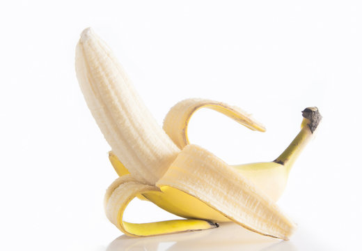 Peeled banana on white background