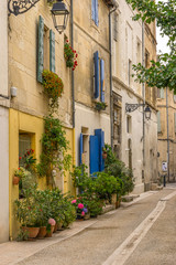 Fototapeta na wymiar A colourful street in the city of Arles in the Bouches du Rhone Provence