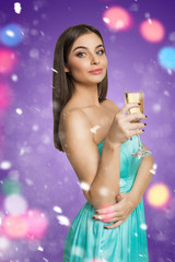 Model standing with glass of champagne