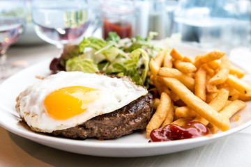 Egg and fries - classical english breakfast with egg and fries