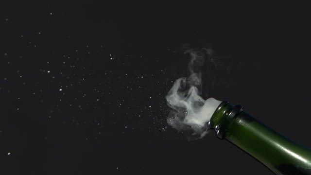 Champagne cork popping in ultra-slow motion