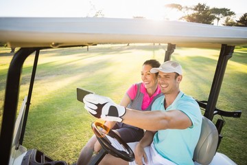Smiling golfer couple taking selfie