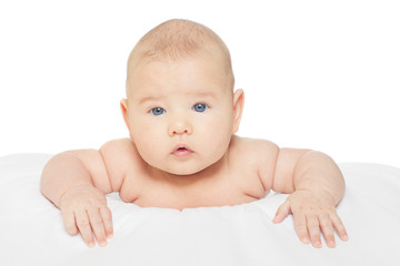 Baby lying on nursing pillow