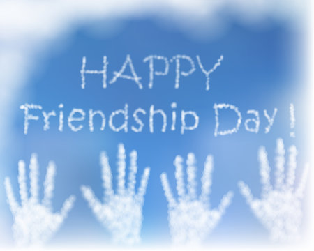 Card with greeting for celebration of friendship day. The hands made of cluds in blue sky.