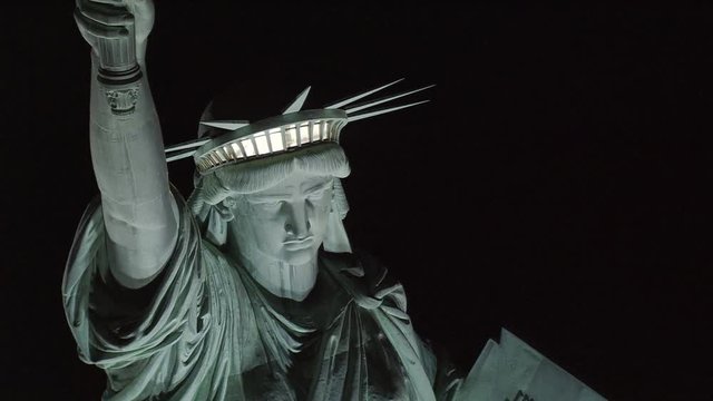 Close flight near Statue of Liberty at night