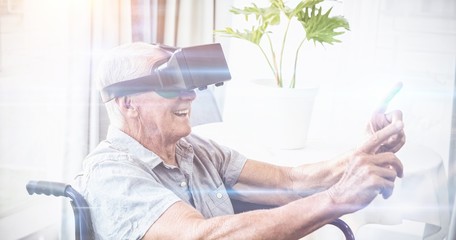 Senior man in a wheelchair using a virtual reality device