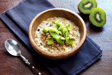Homemade granola with milk and kiwi
