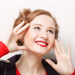 Fototapeta premium Close-up portrait of young beautiful woman with attractive tooth