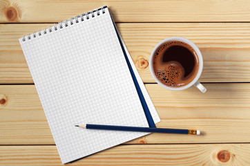Cup of coffee and notepad