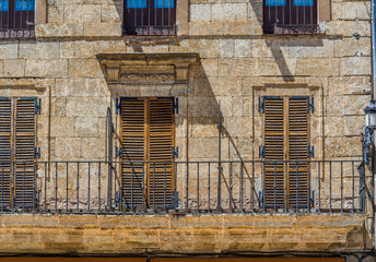 Fototapeta na wymiar Antique european building with balcony. Spain