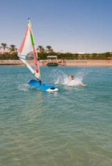 Young woman falls off the board for windsurfing in Egypt, Hurgha