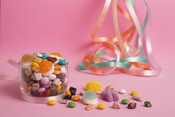 colorful sugar on the pink background