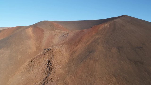Past Mauna Loa crater and cinder cone with observatory ridge at left. Shot in 2010.