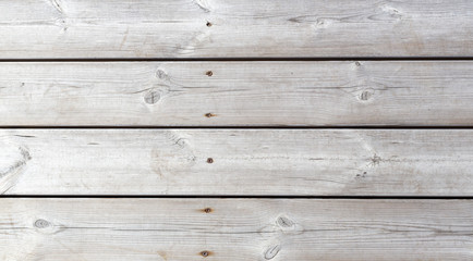Gray wooden textured pier with pins. Horizontal.