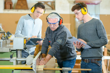 Male students in a woodwork class