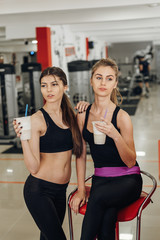 Fototapeta na wymiar Two girls in the gym