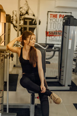 Beautiful brunette girl in the gym