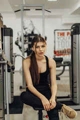 Beautiful brunette girl in the gym