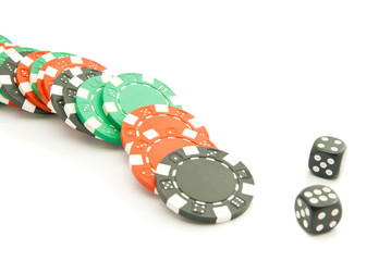 black, green and red chips and dices
