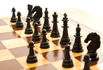 black chess figures on chessboard