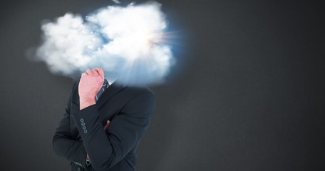 Composite image of happy businessman standing with hand on chin