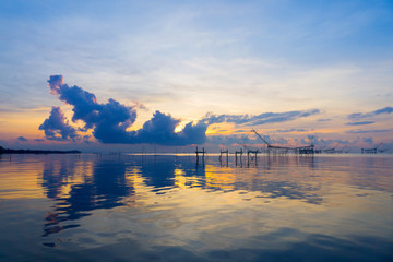 Fototapeta na wymiar Seascape of sunrise with colorful sky at Pakpar, Pattalung, Thailand