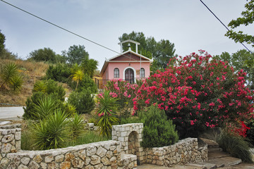 Naklejka premium Orthodox church with spring flowers, Kefalonia, Ionian islands, Greece