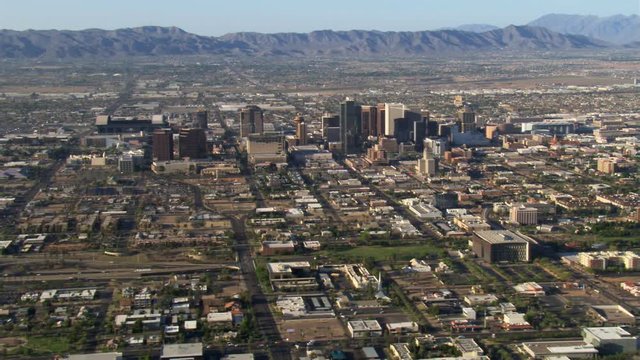 Wide orbit of Phoenix with downtown in mid-frame, mountains in background. Shot in 2007.