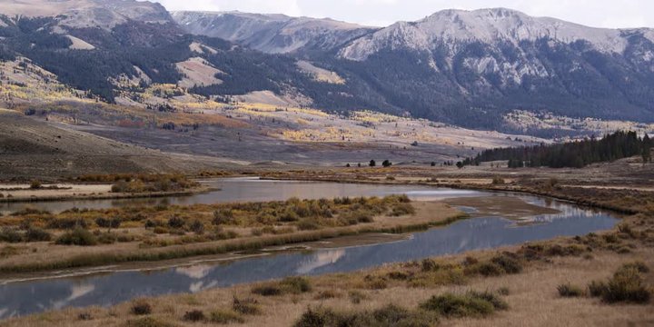Timelapse of a winding river in Green River Valley and Wind River Mountain Range in Wyoming