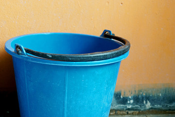  Blue water plastic bucket  in the restroom