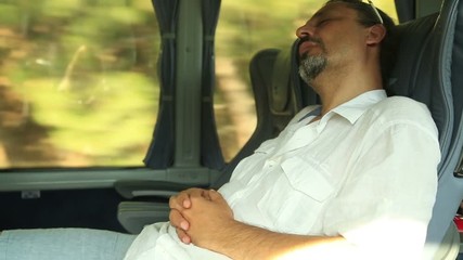 Traveler man sleeping in a bus - Powered by Adobe