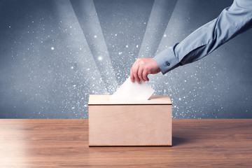 Ballot box with person casting vote