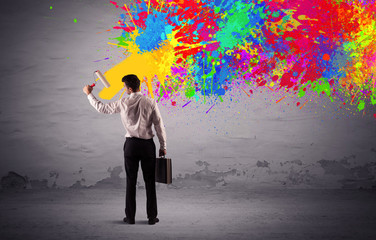 Sales person painting colorful splatter