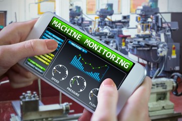 Composite image of hand holding smartphone