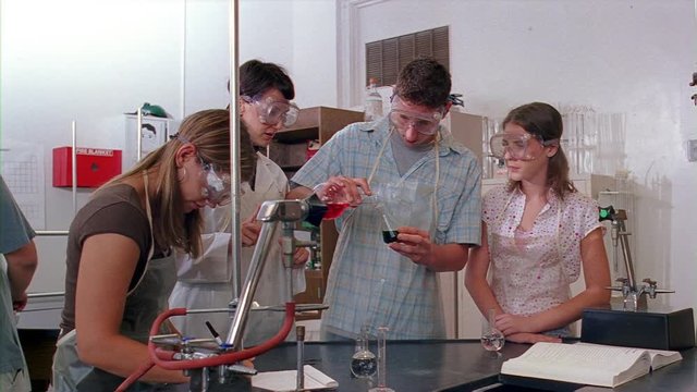 High school students taking part in a chemistry lab experiment