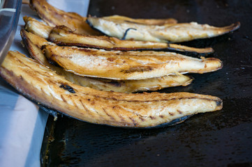 Grilled fish fillets. Traditional Turkish bonito fish snack on street food stall