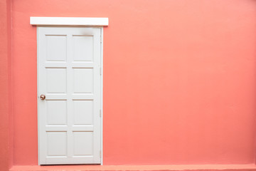 White door classic vintage on the color pink wall background
