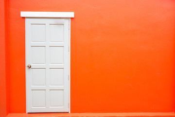 White door classic vintage on the color red wall background