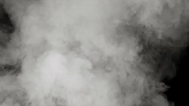 Rising puffs of smoke billowing toward top of frame