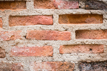 Aged street wall background, old red brick texture background