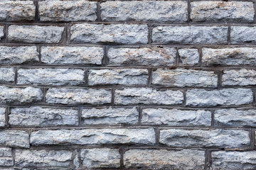 Old grunge grey brick wall texture
