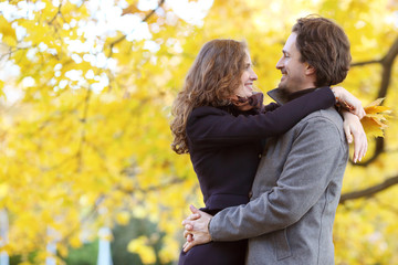 Fototapeta premium Couple hugging in autumn park