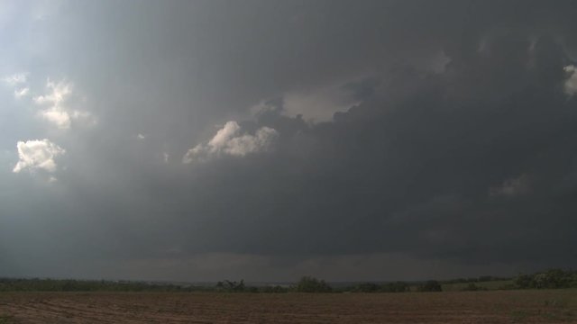 Storm clouds darkening a prairie landscape