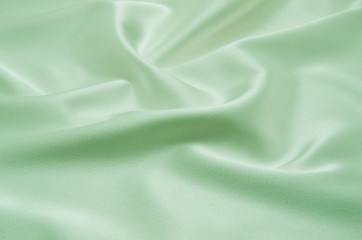 Green satin fabric as background