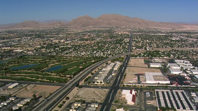 Flying over outlying Las Vegas above I-15 and Las Vegas Boulevard. Shot in 2008.