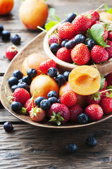 Concept of summer healthy food with strawberry, blueberry and ap